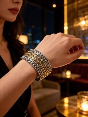 Vintage silver tone cuff bracelet featuring spring hinge.